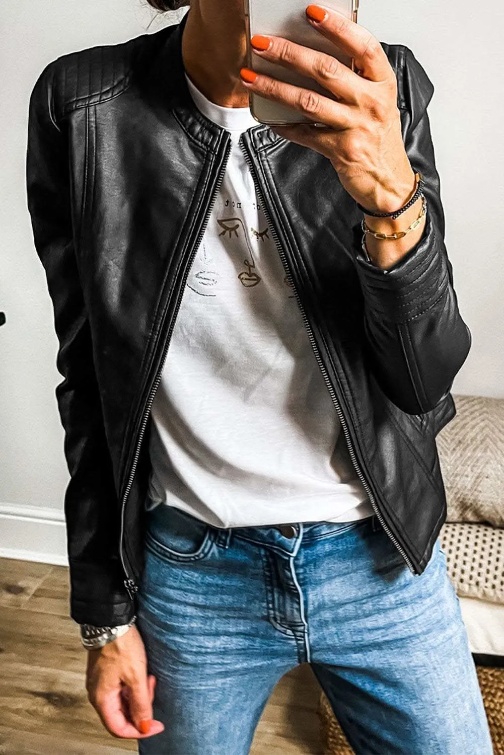 Sleek black faux leather bomber jacket